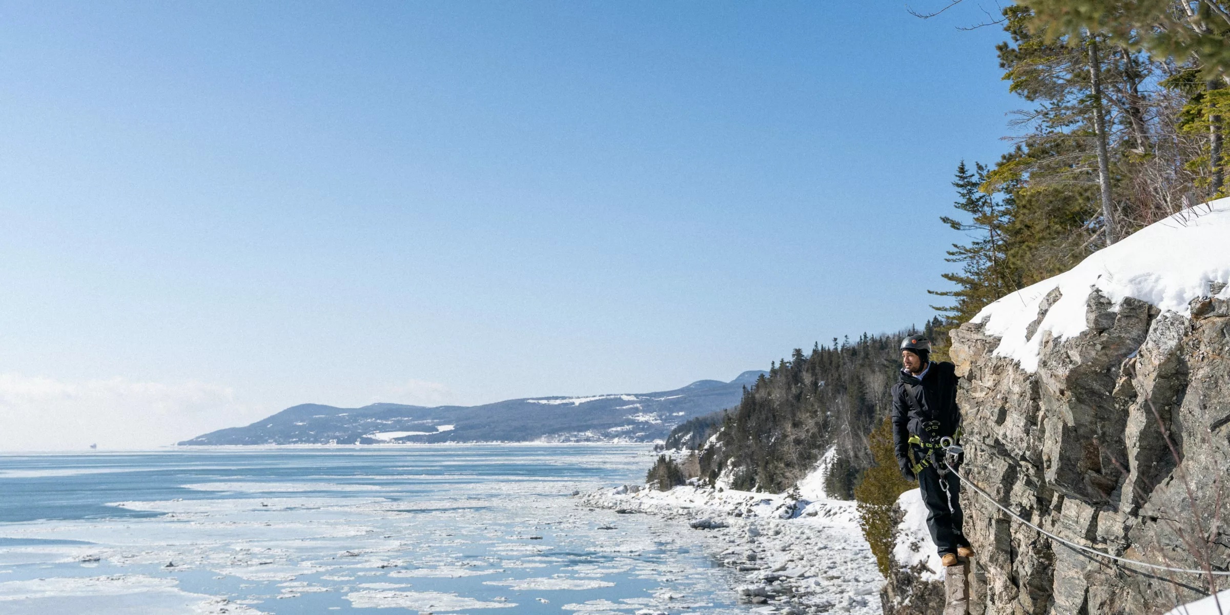 Via ferrata on the rock face at Manoir Richelieu with St. Lawrence River views