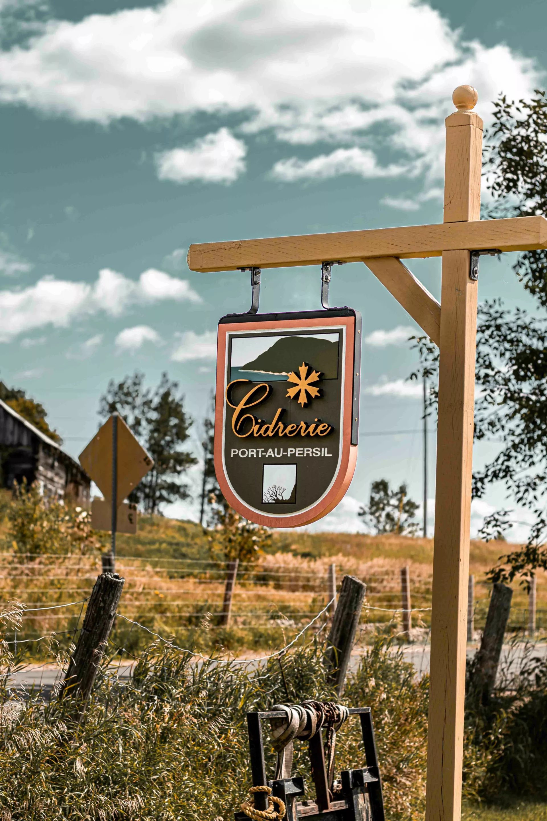 Sign for Cidrerie Port-au-Persil in the rural Charlevoix landscape